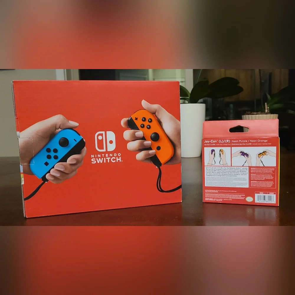 Nintendo Switch with Neon Blue & Neon Orange Joy‑Con and Purple/Yellow Set